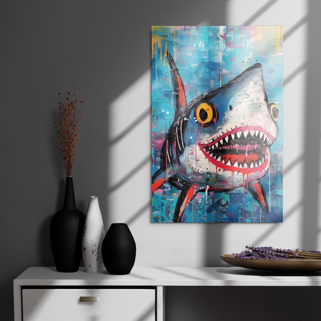 "Neon Predator" glossy metal poster 20"x30" on modern gray wall above console decor with window-light shadows, contemporary graffiti shark wall art with wide open jaws, sharp teeth, yellow eyes, and colorful paint-drip accents, by GiveMeMood